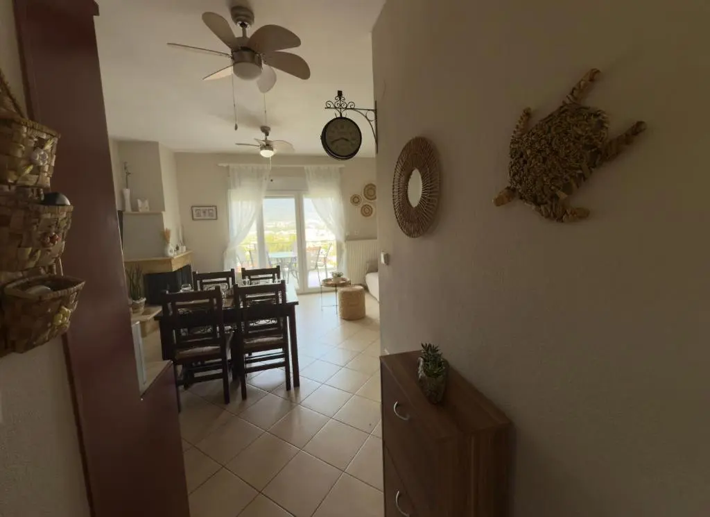Living area with fireplace and view