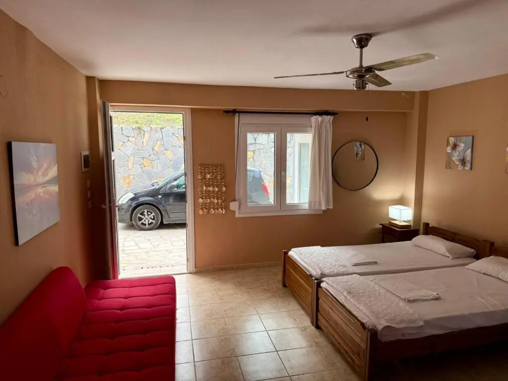 Bedroom with double beds and garden access
